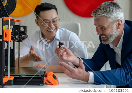 Innovative industrial engineers using 3D printer to build complex component. Innovative industrial engineers using 3D printer to build complex component. 106183901