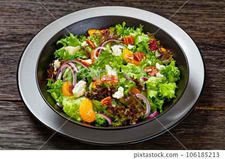 Mandarin Orange Salad in black bowl, top view Mandarin Orange Salad in black bowl, top view 106185213