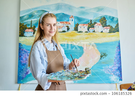 Portrait of young woman artist painting picture on canvas Portrait of young woman artist painting picture on canvas 106185326
