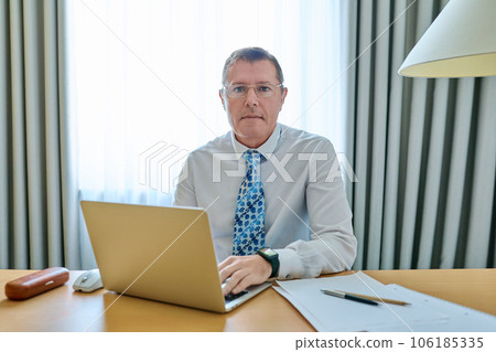 Confident mature male leader manager at workplace, in office 106185335