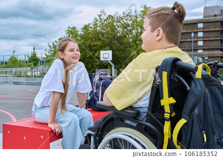 Friendship communication of children of boy in wheelchair and girl 106185352
