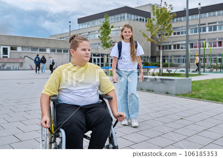 Children go to school, boy 11, 12 years old on wheelchair close-up Children go to school, boy 11, 12 years old on wheelchair close-up 106185353