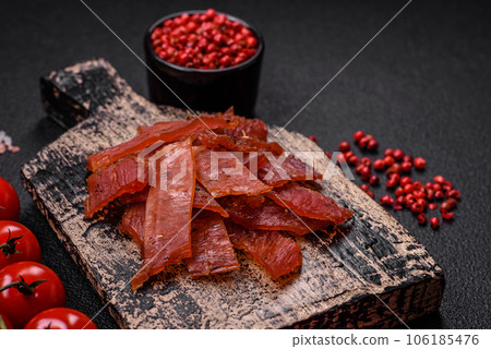 Delicious dried veal or turkey jerky with salt, spices and herbs 106185476