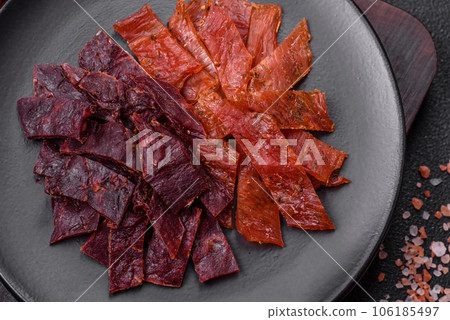 Delicious dried veal or turkey jerky with salt, spices and herbs 106185497