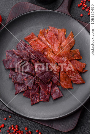 Delicious dried veal or turkey jerky with salt, spices and herbs Delicious dried veal or turkey jerky with salt, spices and herbs 106185499