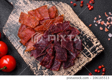 Delicious dried veal or turkey jerky with salt, spices and herbs Delicious dried veal or turkey jerky with salt, spices and herbs 106185513