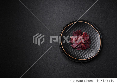 Delicious dried veal or turkey jerky with salt, spices and herbs Delicious dried veal or turkey jerky with salt, spices and herbs 106185519