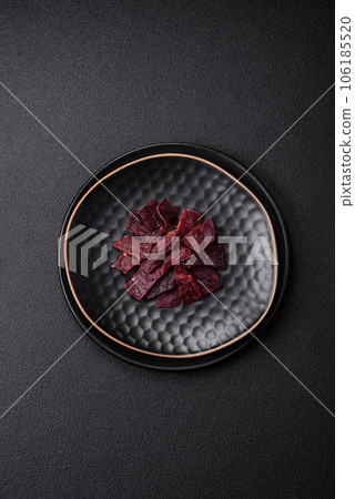 Delicious dried veal or turkey jerky with salt, spices and herbs Delicious dried veal or turkey jerky with salt, spices and herbs 106185520