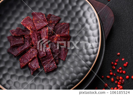 Delicious dried veal or turkey jerky with salt, spices and herbs Delicious dried veal or turkey jerky with salt, spices and herbs 106185524