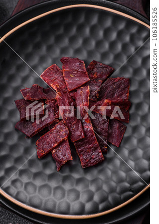 Delicious dried veal or turkey jerky with salt, spices and herbs Delicious dried veal or turkey jerky with salt, spices and herbs 106185526
