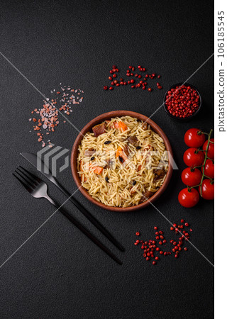 Delicious Uzbek pilaf with chicken, carrots, barberry, spices and herbs Delicious Uzbek pilaf with chicken, carrots, barberry, spices and herbs 106185545