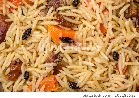 Delicious Uzbek pilaf with chicken, carrots, barberry, spices and herbs Delicious Uzbek pilaf with chicken, carrots, barberry, spices and herbs 106185552