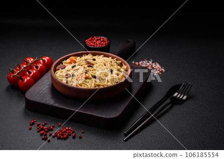 Delicious Uzbek pilaf with chicken, carrots, barberry, spices and herbs Delicious Uzbek pilaf with chicken, carrots, barberry, spices and herbs 106185554