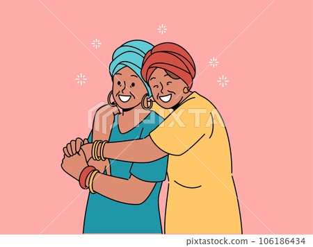 Happy adult mother and daughter in national african clothes embrace together, rejoicing at meeting 106186434