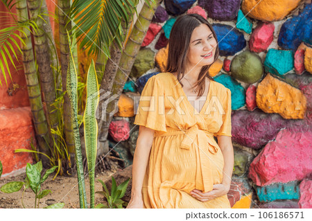 A strong and resilient woman over 40 embraces the beauty of childbirth in Mexico, celebrating the journey of motherhood with cultural richness A strong and resilient woman over 40 embraces the beauty of childbirth in Mexico, celebrating the journey of motherhood with cultural richness 106186571