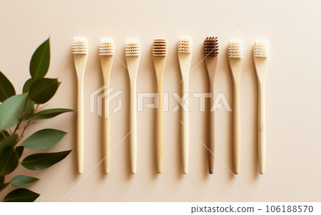 ecological bamboo toothbrushes on beige background. High quality photo ecological bamboo toothbrushes on beige background. High quality photo 106188570