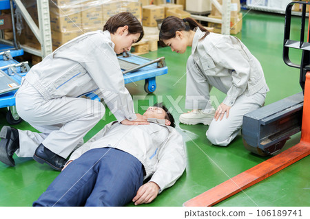 Worker giving heart massage in warehouse Worker giving heart massage in warehouse 106189741