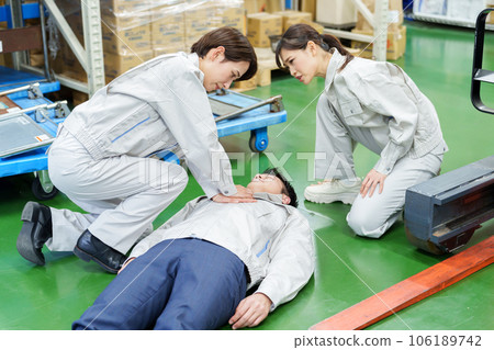 Worker giving heart massage in warehouse 106189742