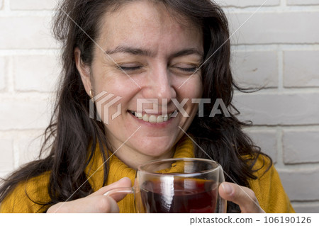 pretty middle-aged woman laughs while spending time with friends 106190126