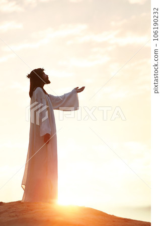 Symbol of Jesus' crucifixion, death and resurrection, sacrifice and suffering, Passion of Jesus Christ wearing a crown of thorns and praying with arms raised, Passion Week and Easter background Symbol of Jesus' crucifixion, death and resurrection, sacrifice and suffering, Passion of Jesus Christ wearing a crown of thorns and praying with arms raised, Passion Week and Easter background 106190232