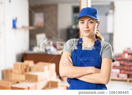 Young woman construction worker standing inside apartment Young woman construction worker standing inside apartment 106190485