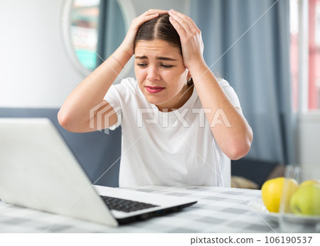 Young girl informs the doctor by video link about a severe headache Young girl informs the doctor by video link about a severe headache 106190537