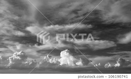 Bubbling cumulonimbus and high cirrus clouds from summer to autumn sky b-6 high contrast monochrome 106190741