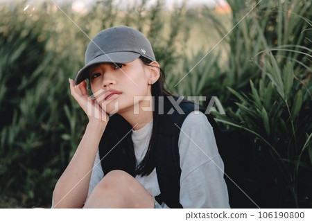 Backpacker woman resting in the grass 106190800