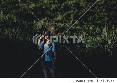 Backpacker woman walking in nature 106191037