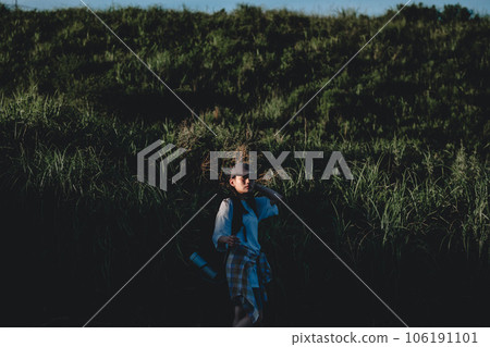 Backpacker woman walking in nature Backpacker woman walking in nature 106191101