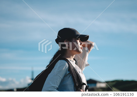 woman carrying a backpack 106191130