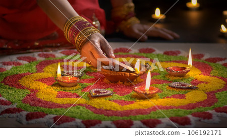 Clay diya lamps lit during diwali celebration, Diwali, or Deepavali, is India's biggest and most important holiday. Clay diya lamps lit during diwali celebration, Diwali, or Deepavali, is India's biggest and most important holiday. 106192171