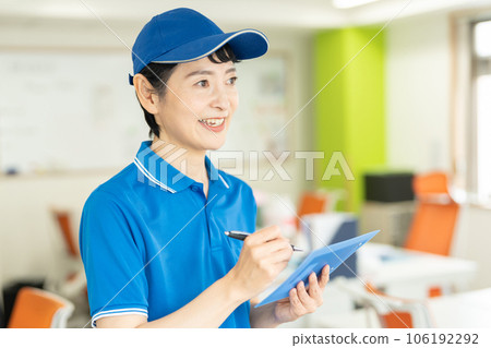 Courier female driver delivering luggage 106192292