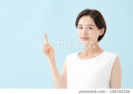 Female pointing blue back 106192588