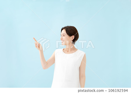 Female pointing blue back Female pointing blue back 106192594