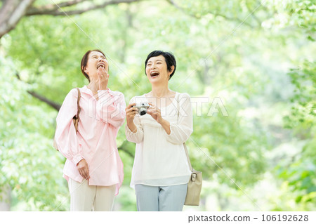 middle-aged woman travel camera 106192628