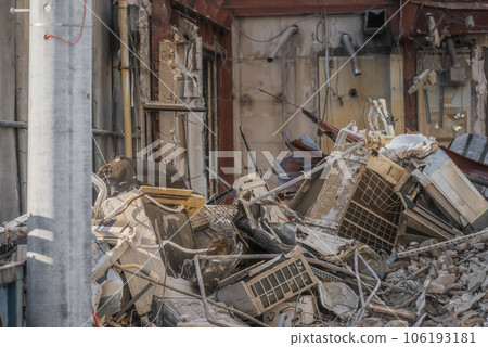 Waste from air conditioning equipment removed during demolition work 106193181