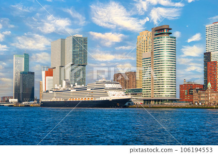 Big cruise ship parked in center of rotterdam. View of the skyscrapers of rotterdam on a sunny day 106194553