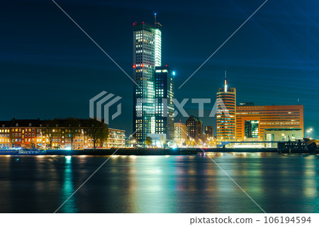 Panoramic view of the night city. Rotterdam city skyline. City towers illuminated panorama 106194594