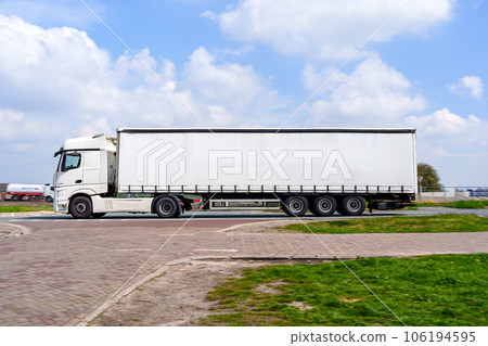 Big truck with semi-trailer Mockup. Truck transportation on the public road 106194595