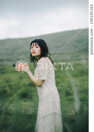 Meadow and white dress woman Meadow and white dress woman 106195163