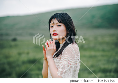 Meadow and white dress woman 106195190