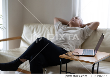A man who gets sleepy from remote work and sleeps on the sofa 106196353