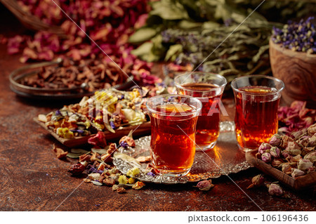 Herbal tea and a mix of various dried medicinal plants and herbs. 106196436