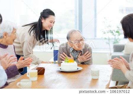 Three generation family grandchild celebrating grandfather 106197012