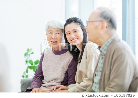 Three generation family grandchild grandmother grandfather 106197029