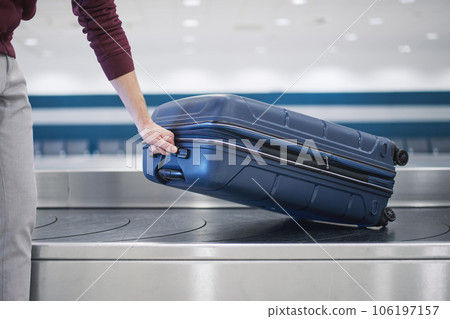Suitcase in baggage claim in airport terminal 106197157