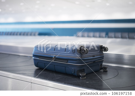Suitcase on baggage claim in airport terminal 106197158