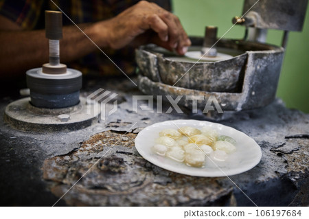 Jeweler is processing Moonstone for jewel. 106197684