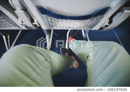 Legroom between seats in airplane. 106197689
